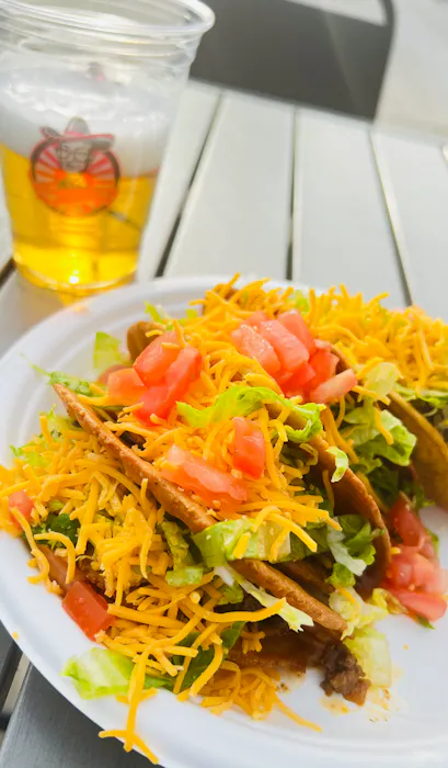 Crispy taco supreme with guacamole and sour cream
